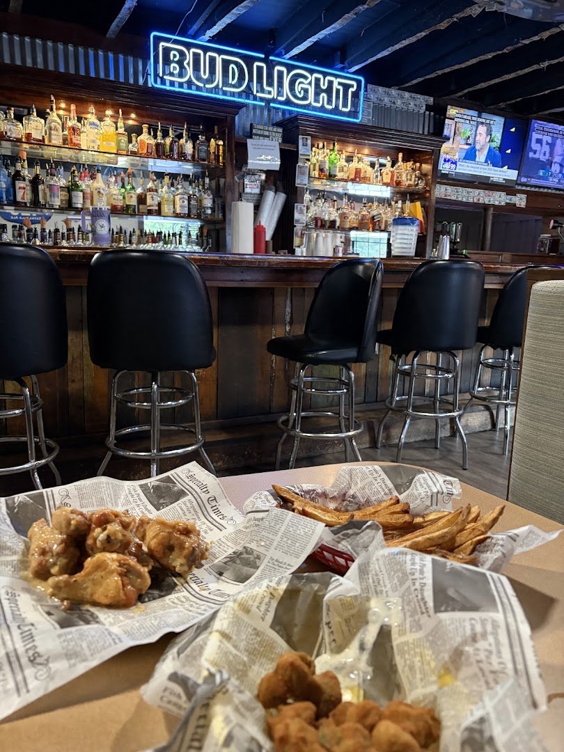 Outdoor seating outside a bar and grill.