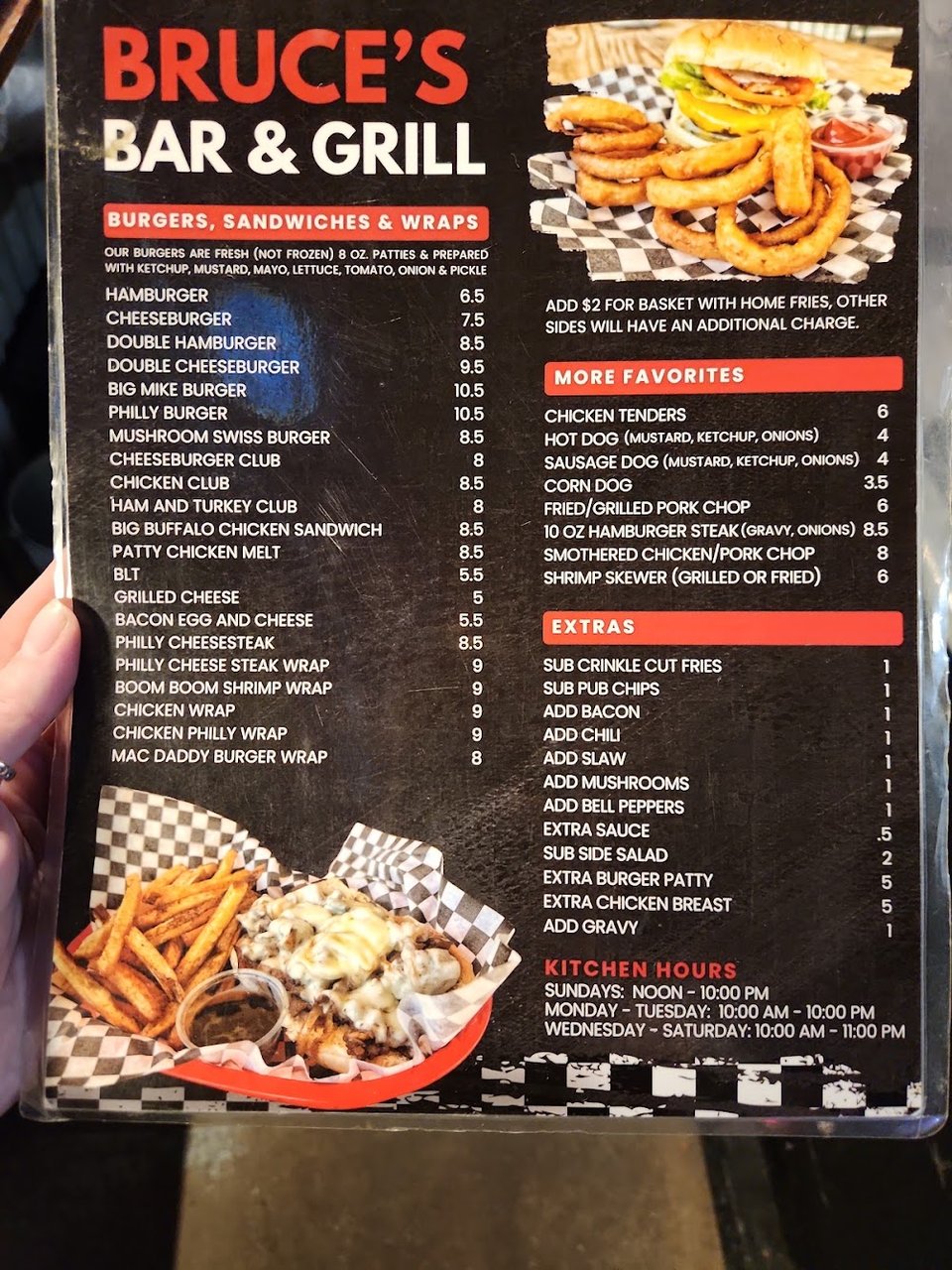 Printed menu showing sides and sandwiches.